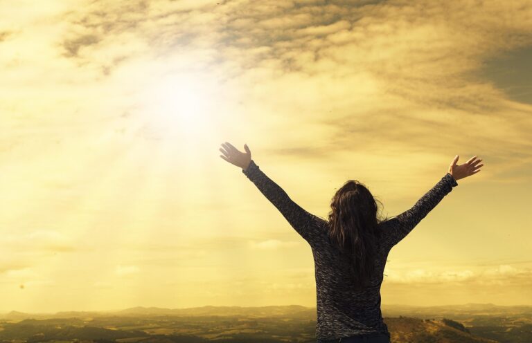 woman, sky, sunlight, arms, open arms, sunbeams, sunrays, clouds, nature, worship, freedom, happiness, relieved, prayer, praise, success, joy